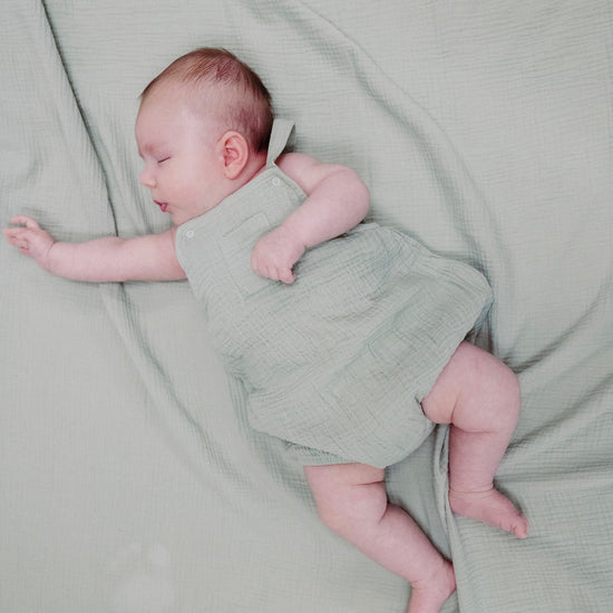 Load image into Gallery viewer, Angel Dear Solid Muslin Desert Green Pocket Sunsuit
